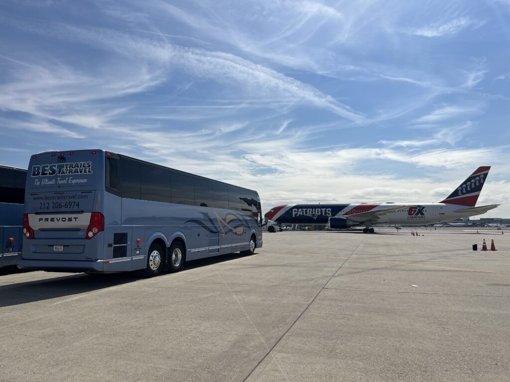 Best Trails & Travel charter bus picking up sports teams at the airport